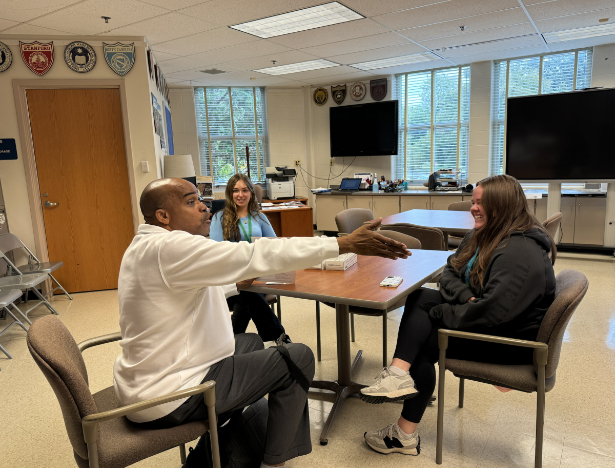 WCHS seniors Claire Moylan and Sydney Barrett discuss applications with the University of Tennessee representative. Seniors have had a hard time getting this one on one time as juniors have been taking prime spots in the registration.	