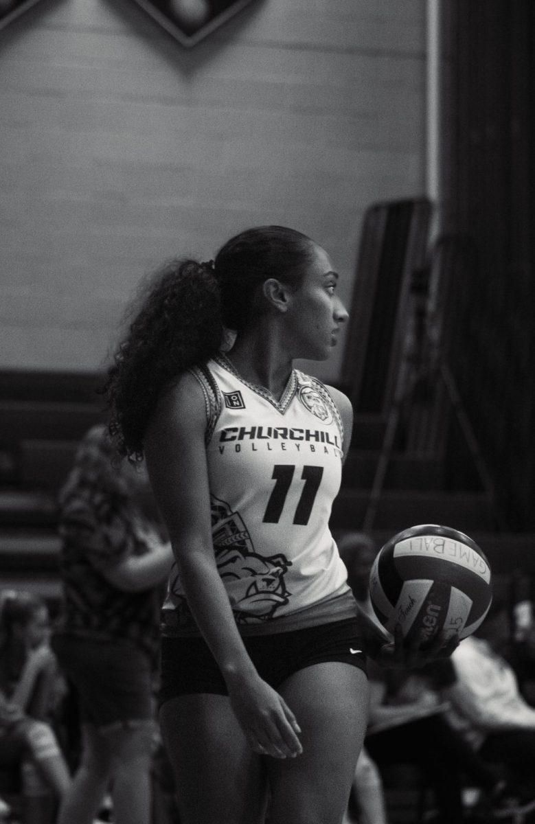 Kareena Rathnam takes the court before her varsity volleyball game. As a captain, Rathnam hopes to lead her team to a successful season.