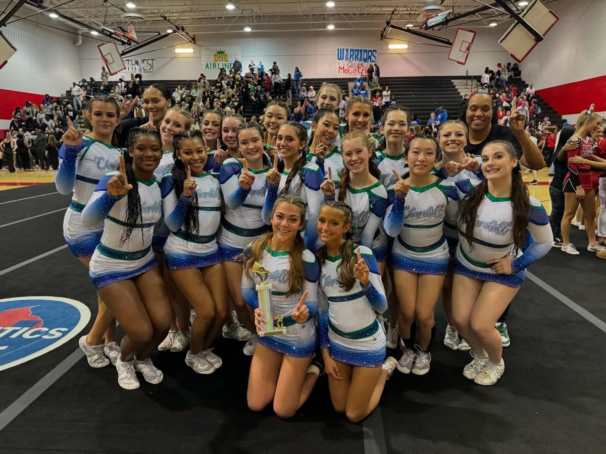 WCHS girls varsity cheer team pose with the 1st place trophy they won at the Division I MCPS County Cheerleading Competition. Their next stop is regionals.	