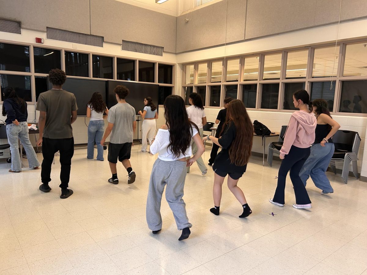 WCHS's first ever Latin dance team XPlosion holds an after school practice in the Cafeteria on October 2, 2024. They start with warm-ups and reviewing basic steps, and then teach choreography to dances like mambo, salsa, cha-cha, and bachata.	