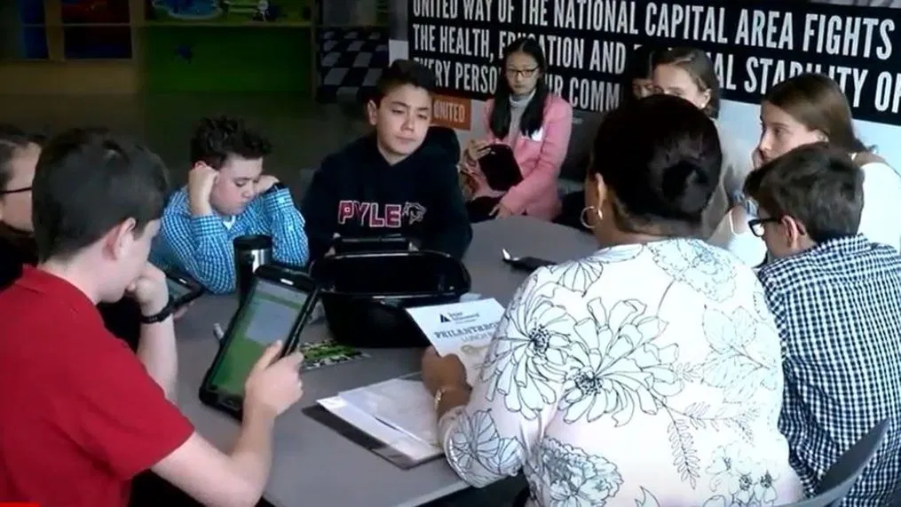 MCPS students discuss financial topics in a classroom. While it has not always been a graduation requirement, many MCPS schools have offered classes on economics.	