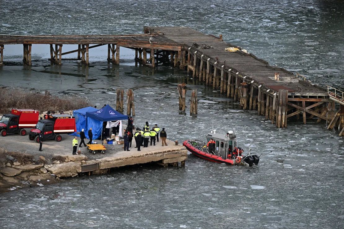 A collection of agencies gather at a dock close to the crash site in order to investigate the crash and figure out what may have caused it.