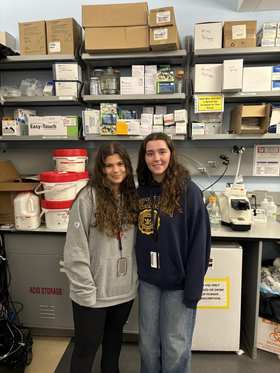 WCHS senior Natalia Caetano stands with her mentor at her internship at The National Institutes of Health. Caetano has a half day schedule that allows her to spend half of her day conducting research in this lab.